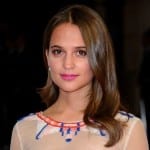 a picture of Alicia Vikander smiling at the BAFTAs